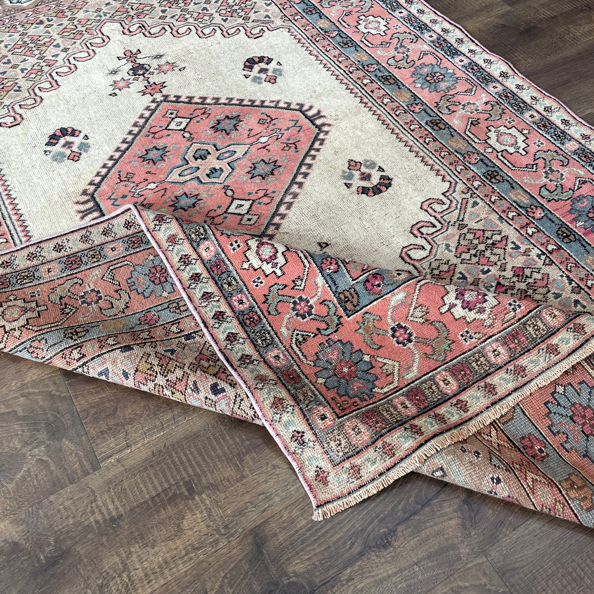Vintage Hand Knotted Fine Wool Rug 4'6" x 7'6" – Soft Pink, Beige & Blue Floral Design