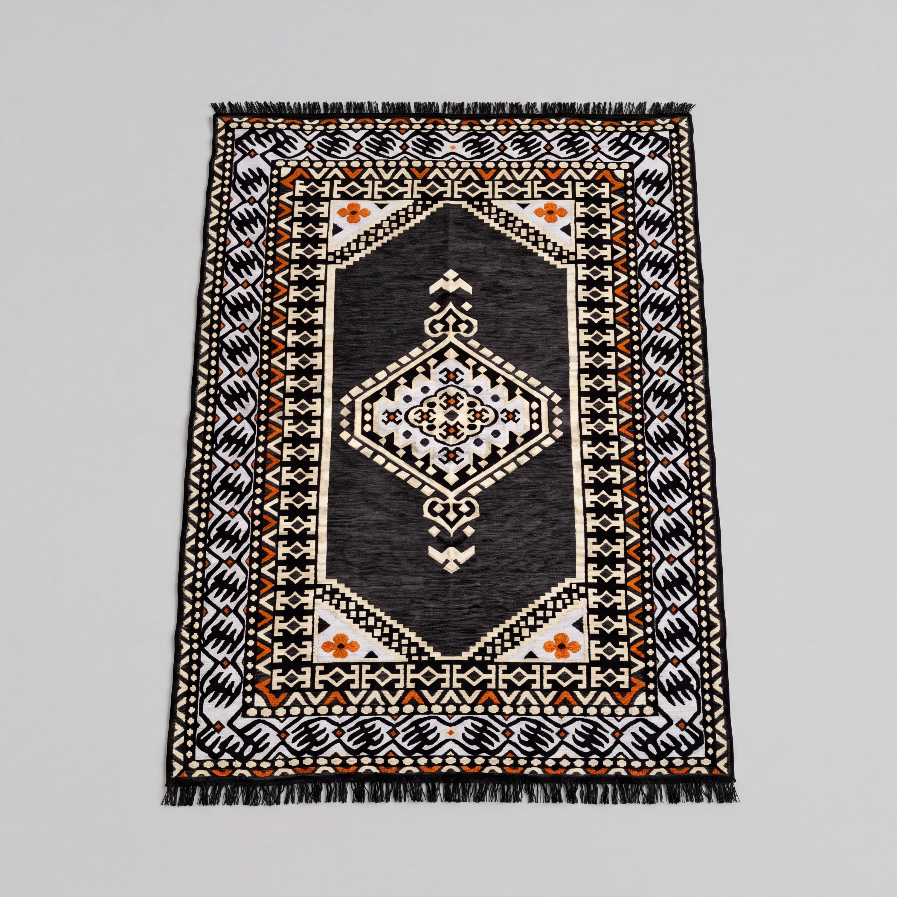 A rectangular 4'x6' woven area rug kilim with a central medallion design, featuring gray, white, and orange geometric patterns with fringe on the top and bottom edges. This kilim is part of the Turkish Arabic Majlis Floor Sofa set.