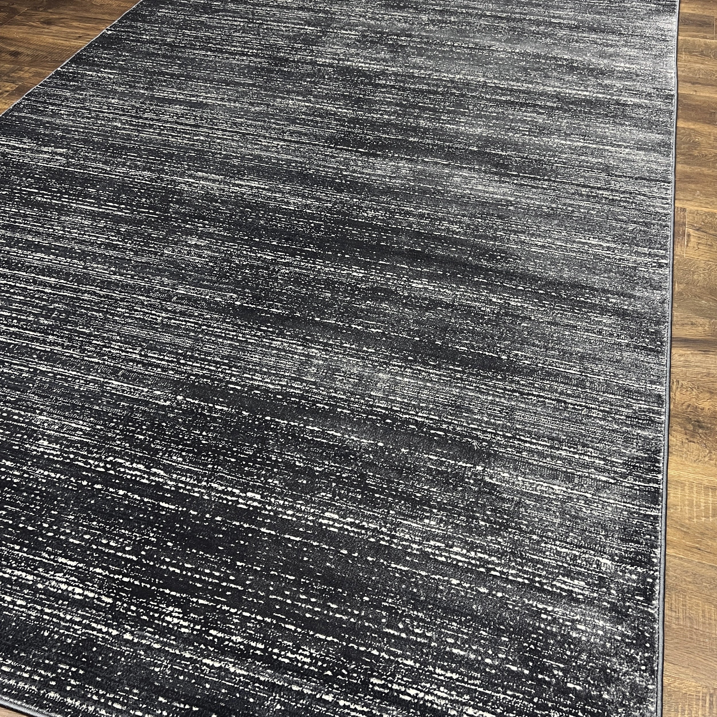 Unity Charcoal Blue Soft Rug with Sleek Minimalist Design