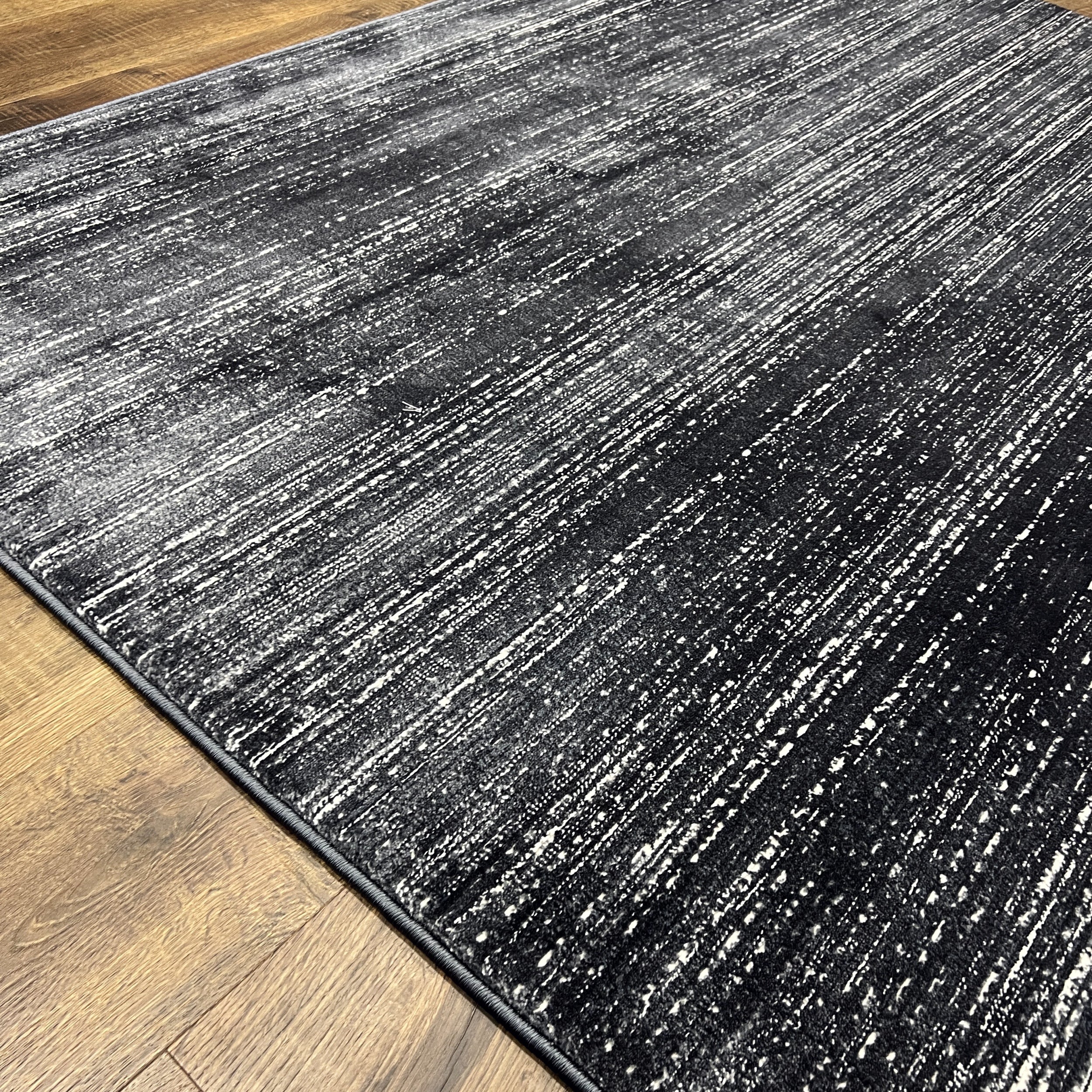 Unity Charcoal Blue Soft Rug with Sleek Minimalist Design