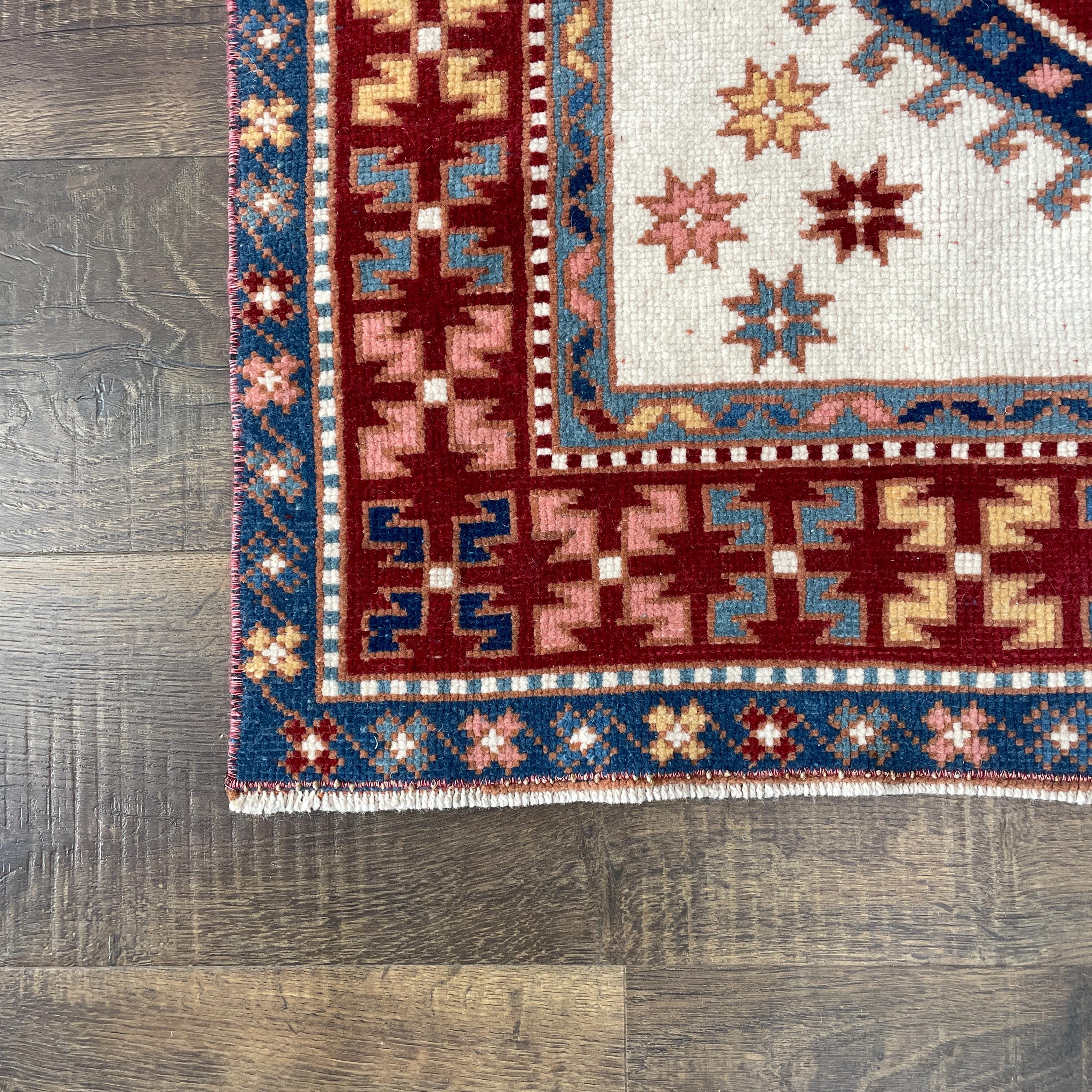 Handmade Turkish Wool Rug: Vintage Red Geometric Medallion