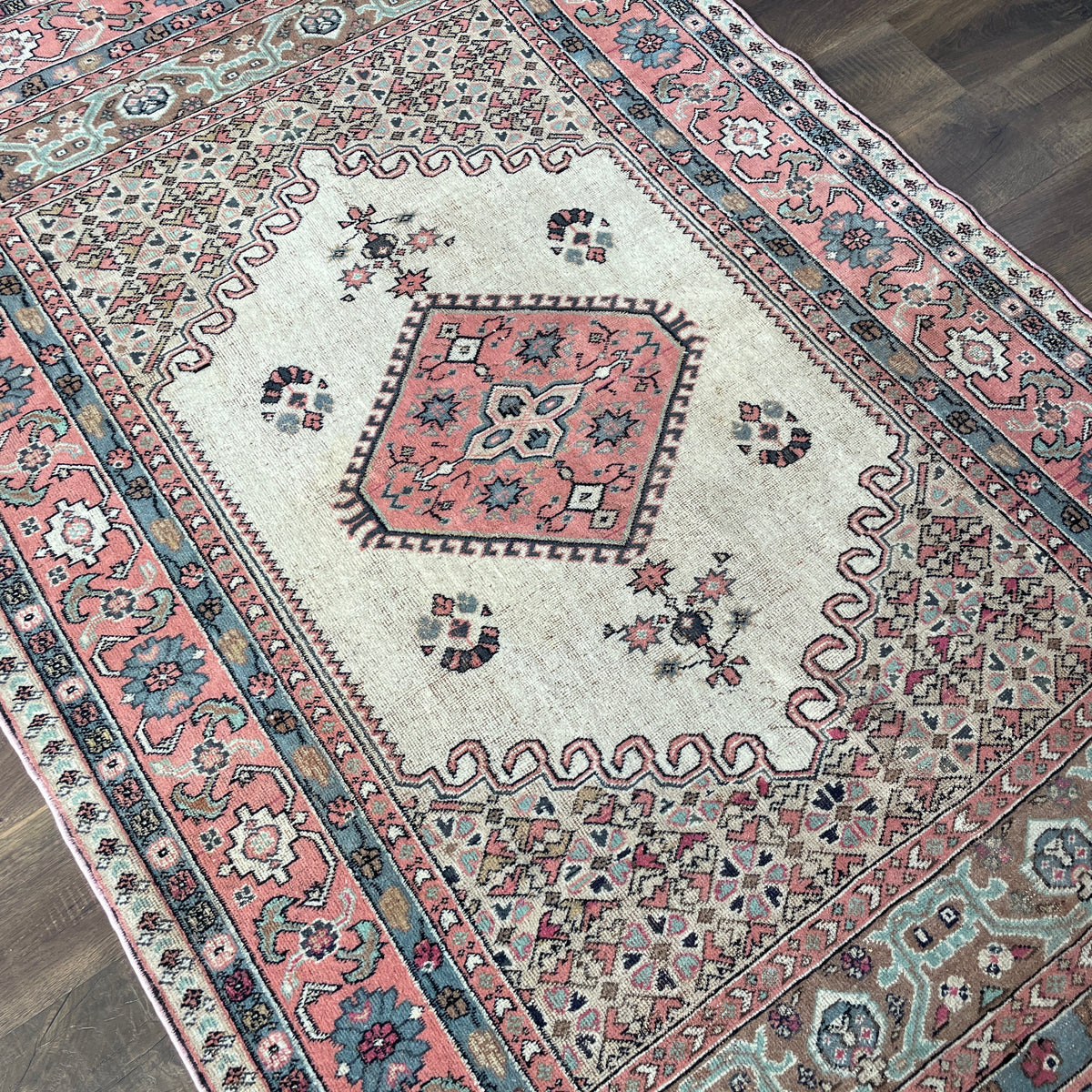 Vintage Hand Knotted Fine Wool Rug 4'6" x 7'6" – Soft Pink, Beige & Blue Floral Design
