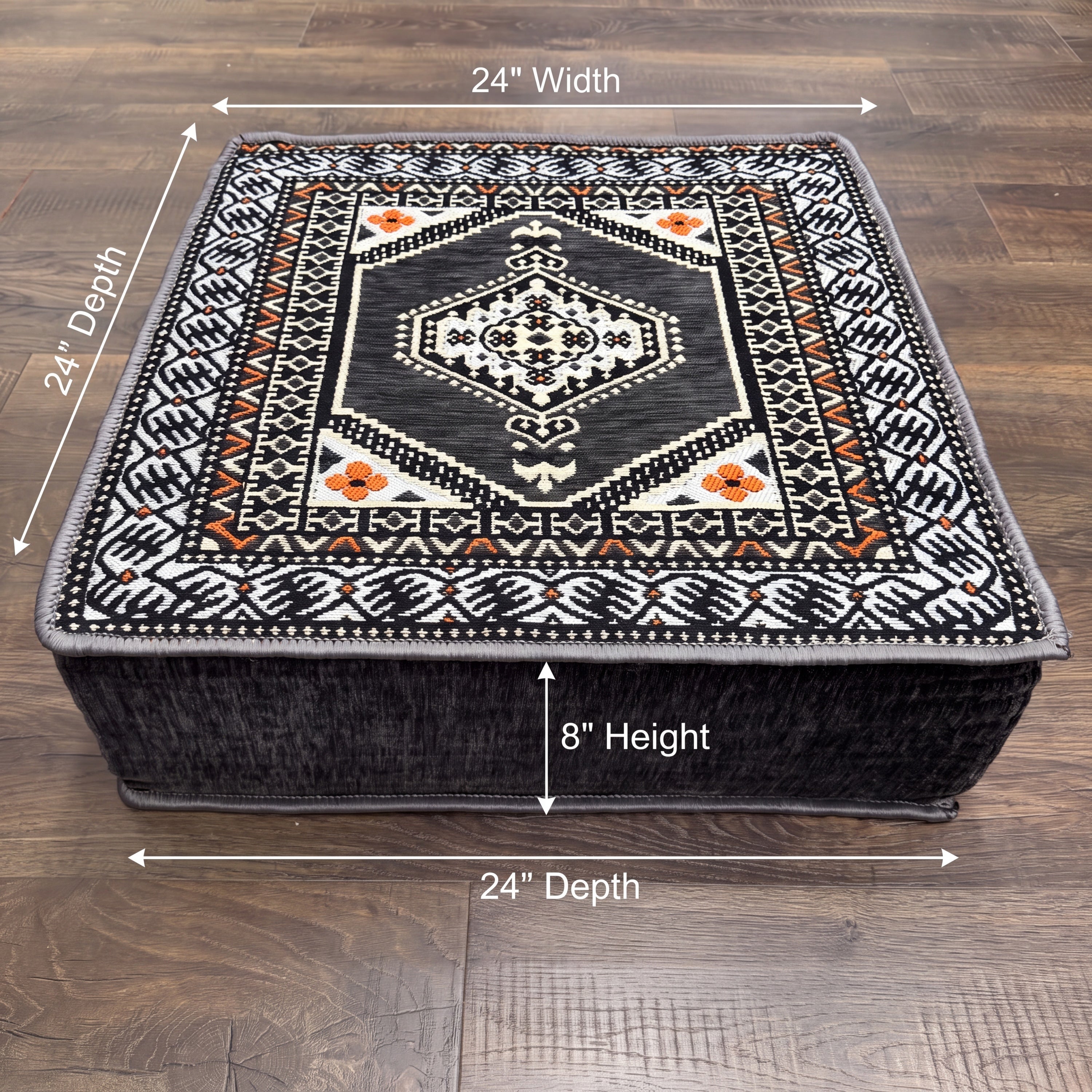 A square 2 feet Ottoman with a detailed geometric Turkish pattern, shown on a wooden floor with dimension lines indicating 24 inches in width and depth, and 8 inches in height. This Ottoman is part of the Gray Arabic Floor Sofa Set.  
