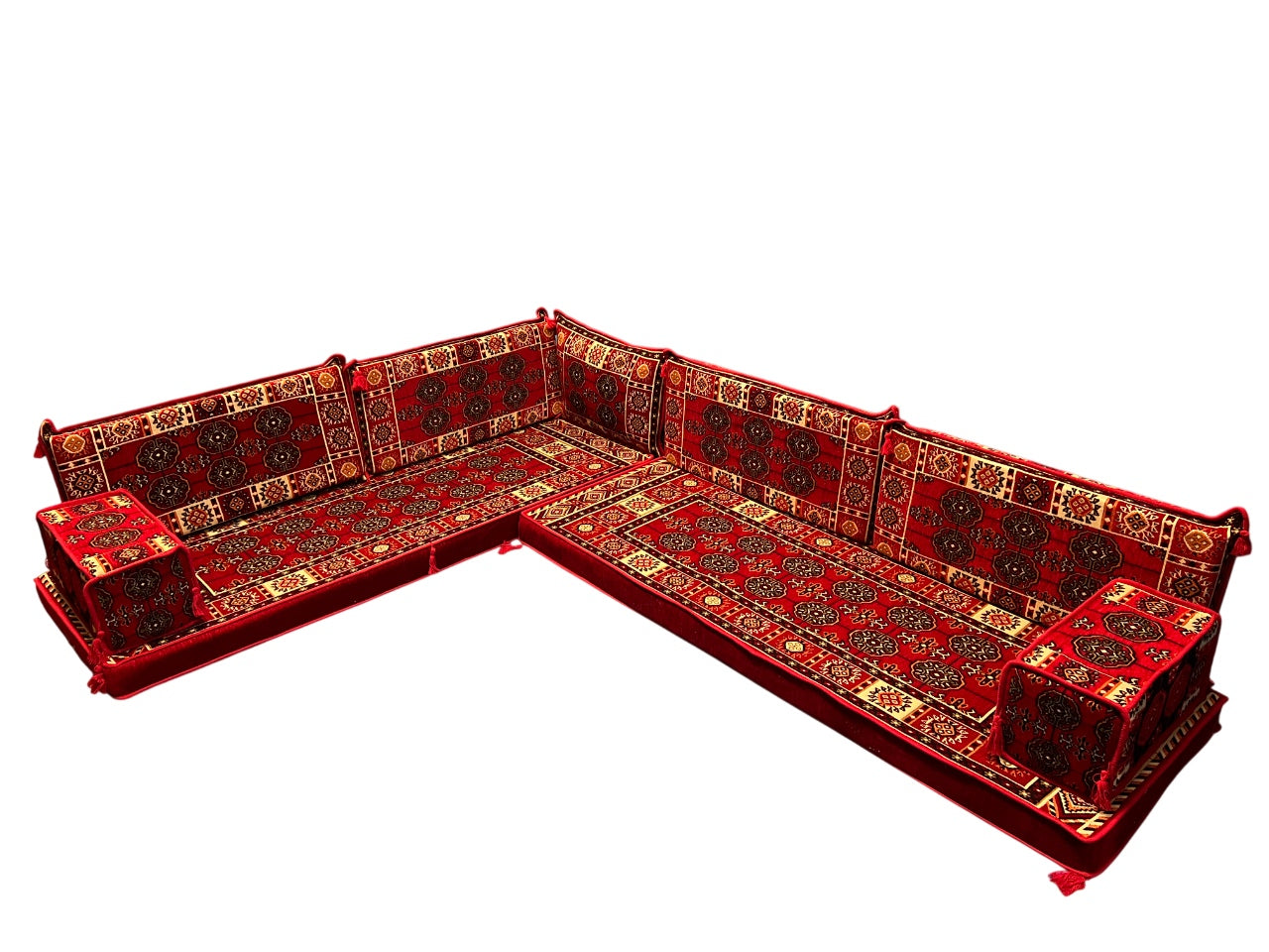 A traditional L-shaped modular sofa set upholstered in rich red with intricate gold and black geometric patterns. This is a product image of Red Bukhara Turkish Majlis Floor Seating L-Shaped Sofa Sectional- 4 Inches