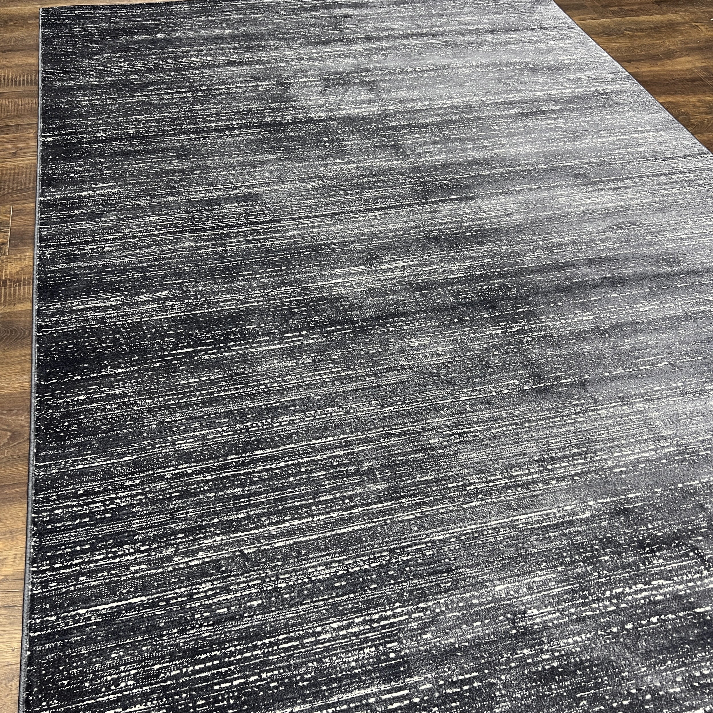 Unity Charcoal Blue Soft Rug with Sleek Minimalist Design