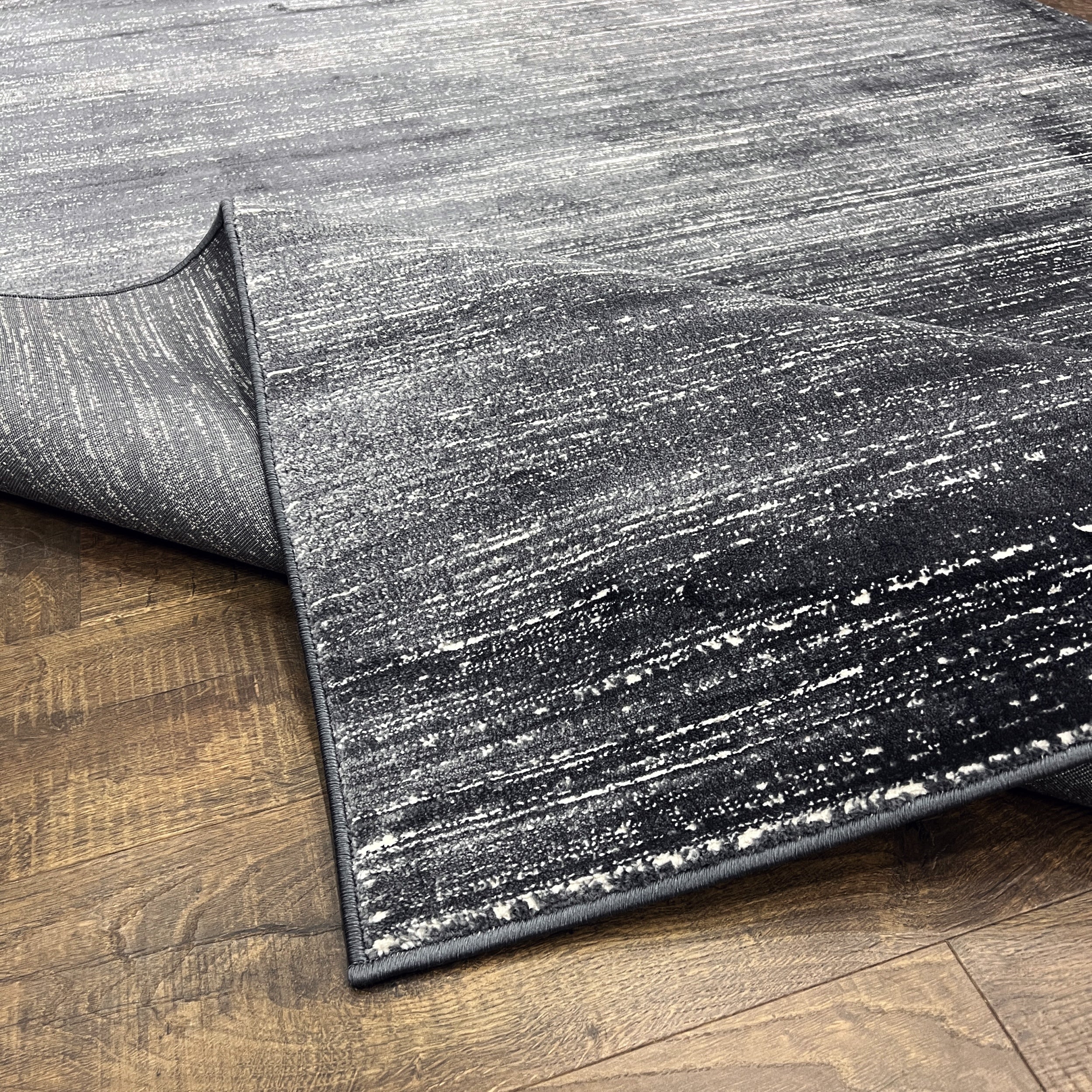 Unity Charcoal Blue Soft Rug with Sleek Minimalist Design