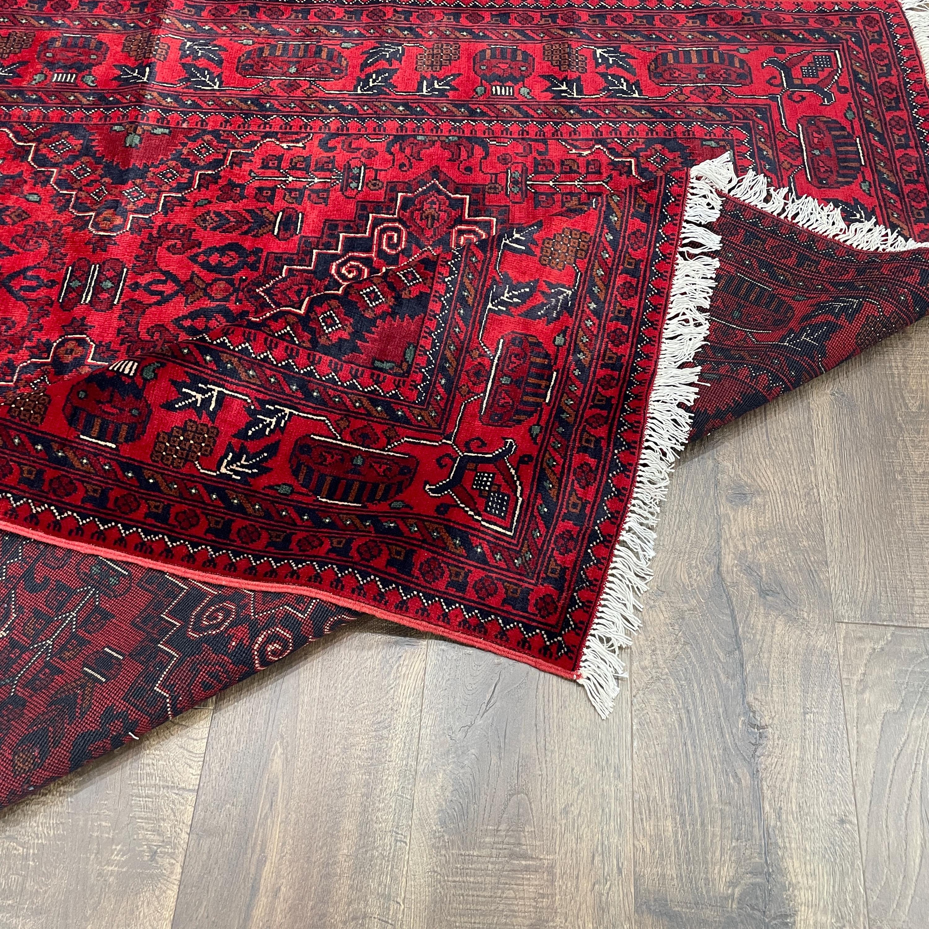 Handmade Red Wool Rug: 5' x 6'9" Turkish Tribal Design