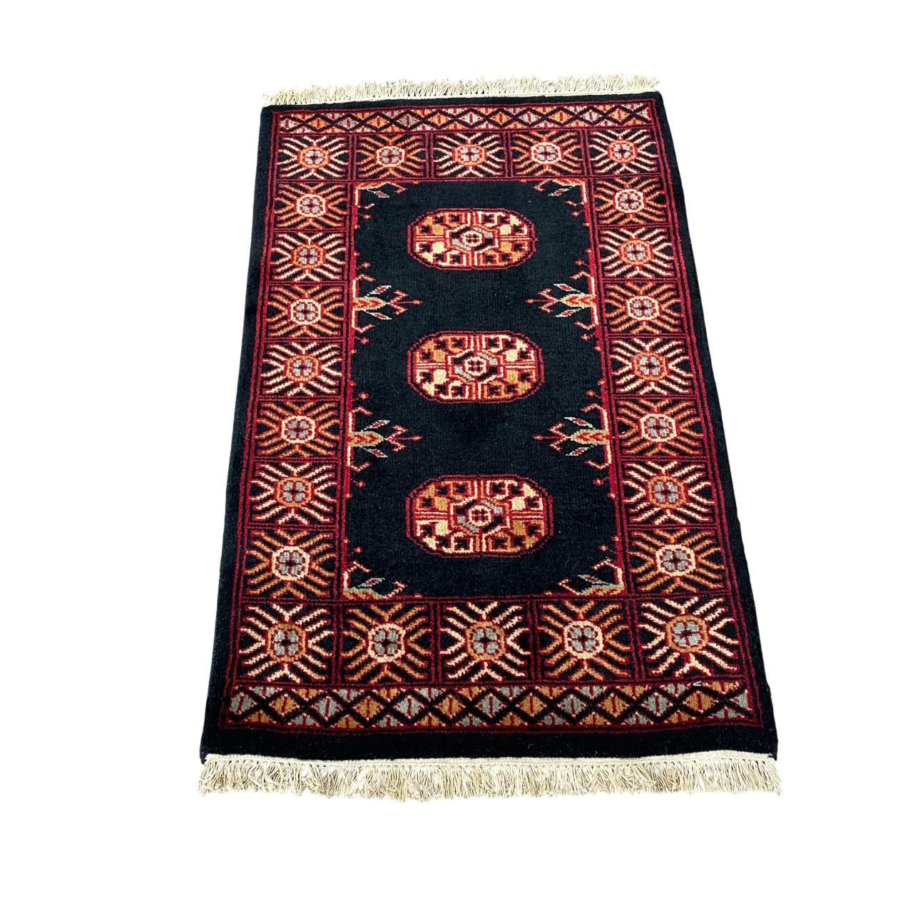 Handmade Turkish Wool Rug: Vintage Black Tribal Design (1'10" x 3')