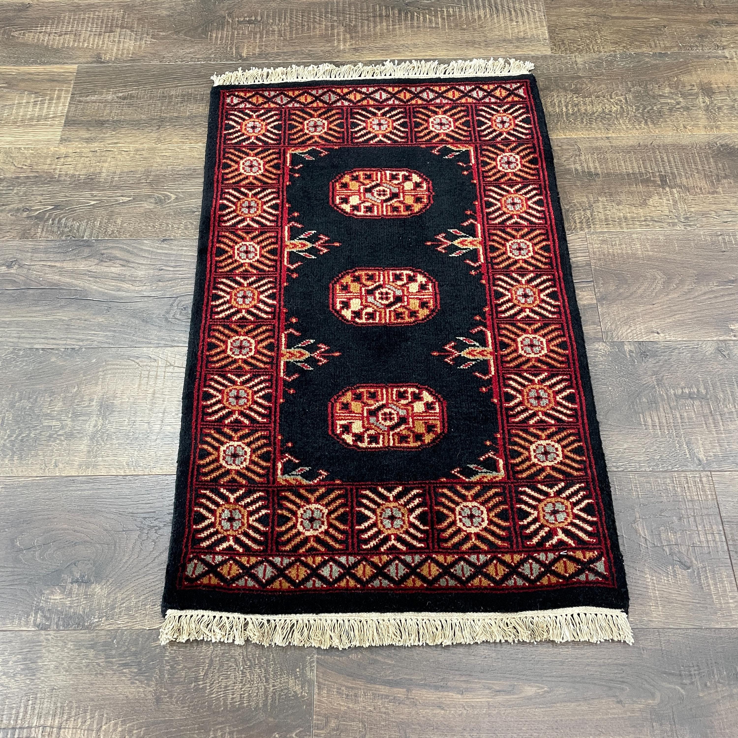 Handmade Turkish Wool Rug: Vintage Black Tribal Design (1'10" x 3')