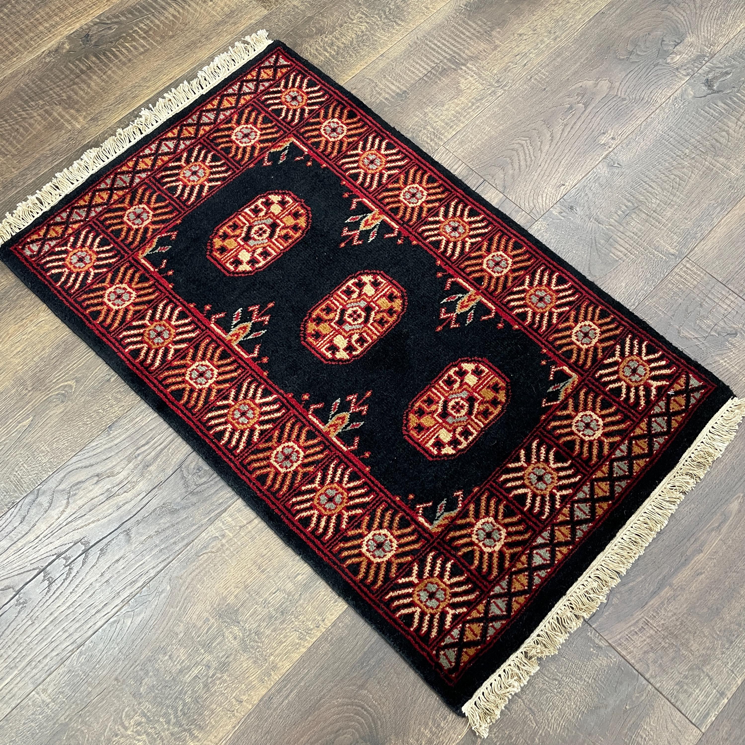 Handmade Turkish Wool Rug: Vintage Black Tribal Design (1'10" x 3')