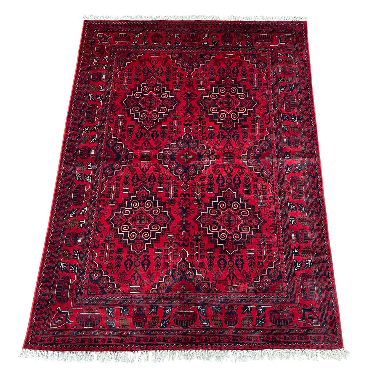 Handmade Red Wool Rug: 5' x 6'9" Turkish Tribal Design
